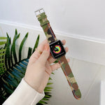 Canvas replacement strap for Apple Watch in camouflage pattern, comfortable and adjustable, shown on a wrist.
